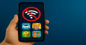 Hand holding a smartphone showing no Wi-Fi symbol with mobile game icons on the screen